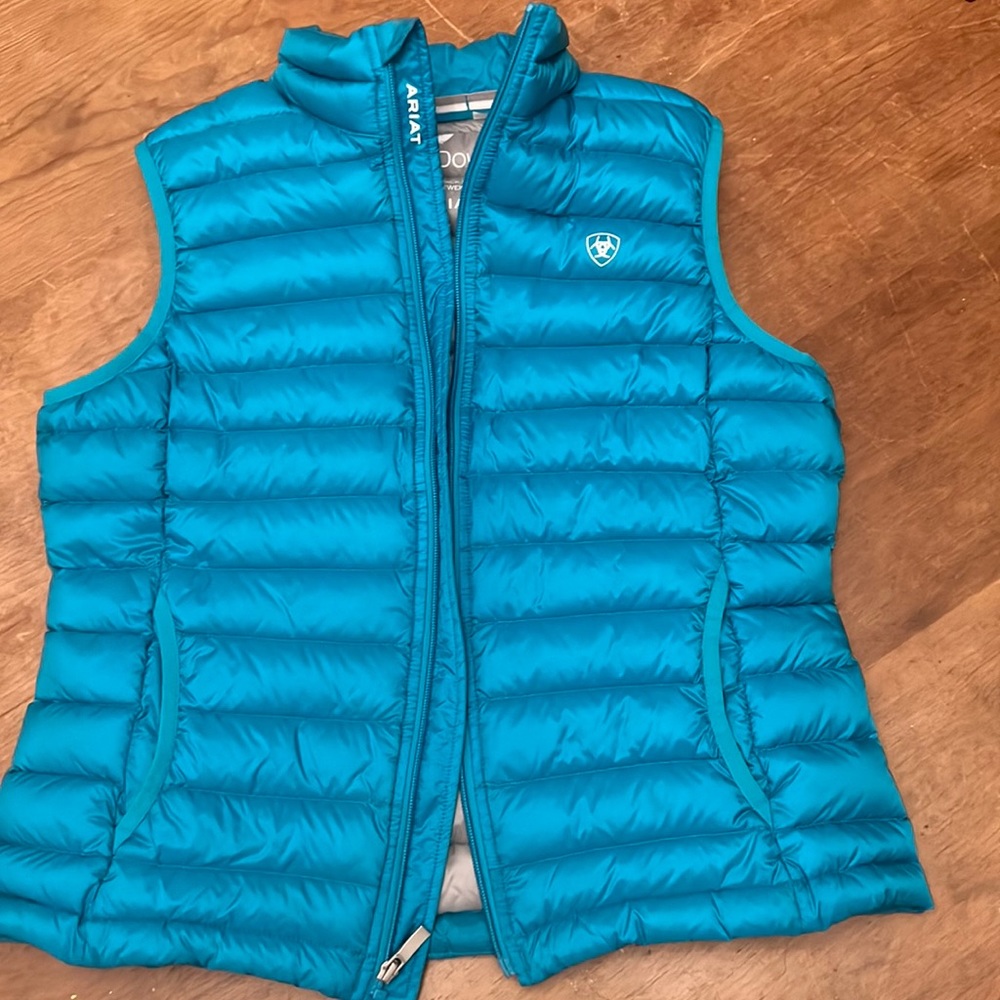 Ariat  Ideal Down vest.   Aqua blue.   Seems to run small.  Fits like medium.